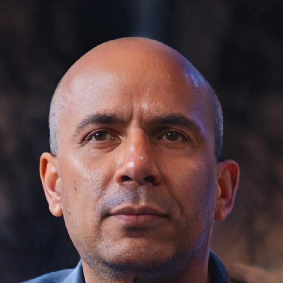 Callum Brynmor standing in office environment