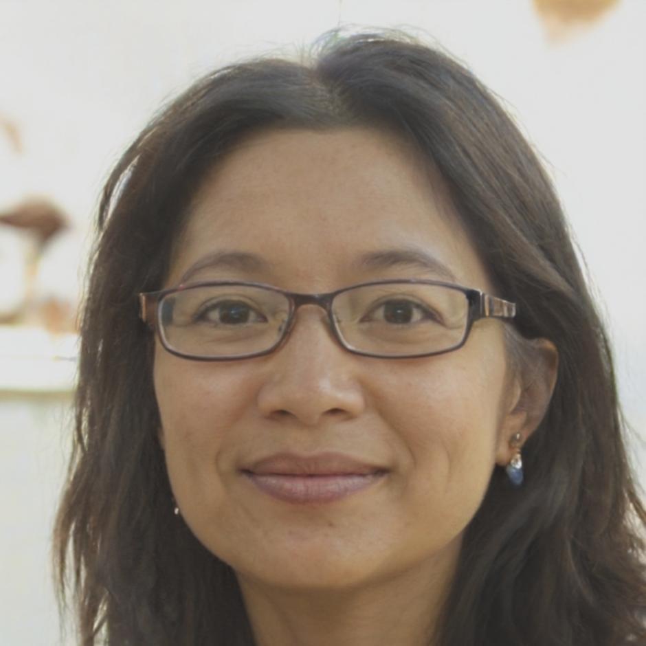 Siobhan Torquil reviewing financial documents at desk